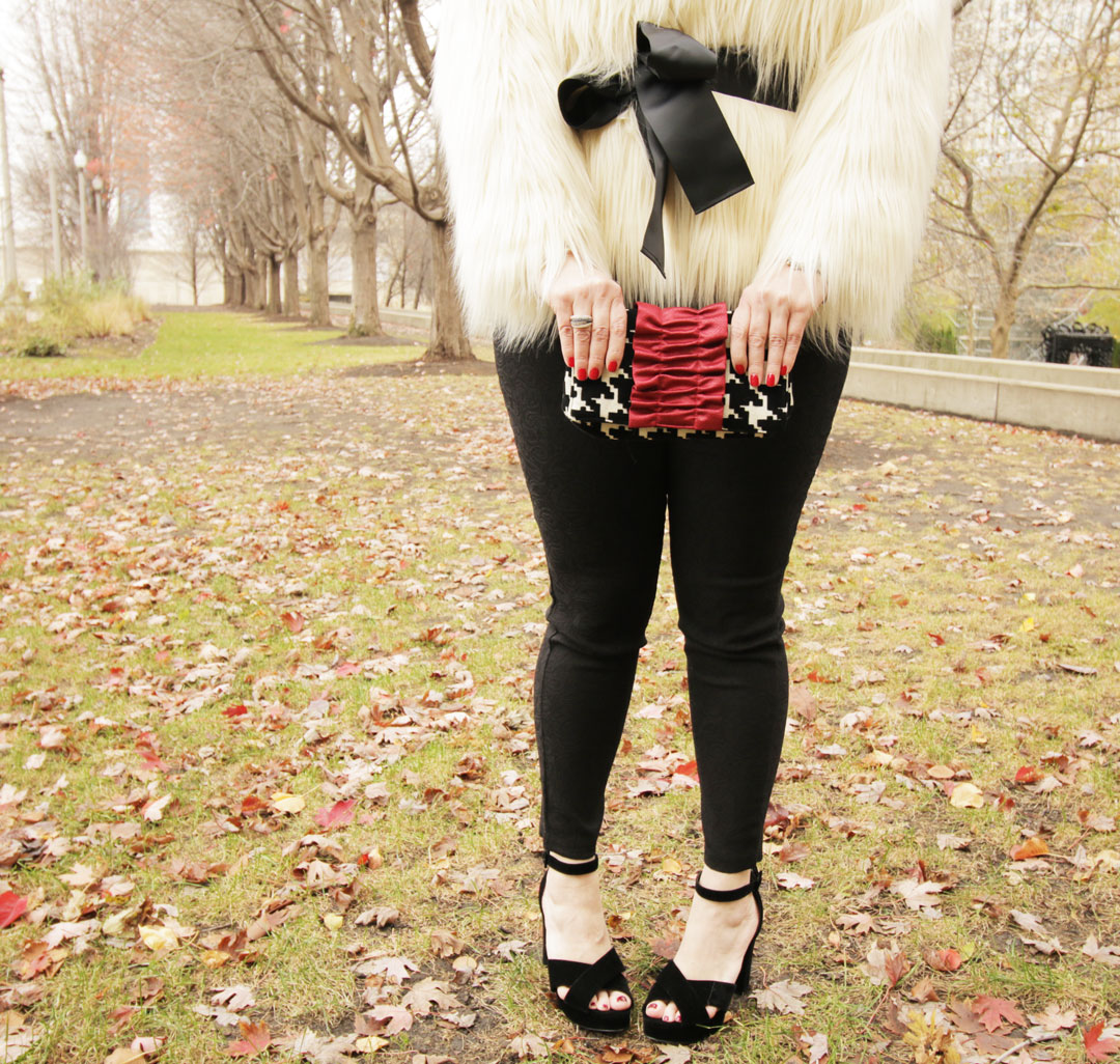 Fashion Blogger in plus size black pants from Torrid, velvet pumps from Simply Be and a White Fur Jacket from Lane Bryant
