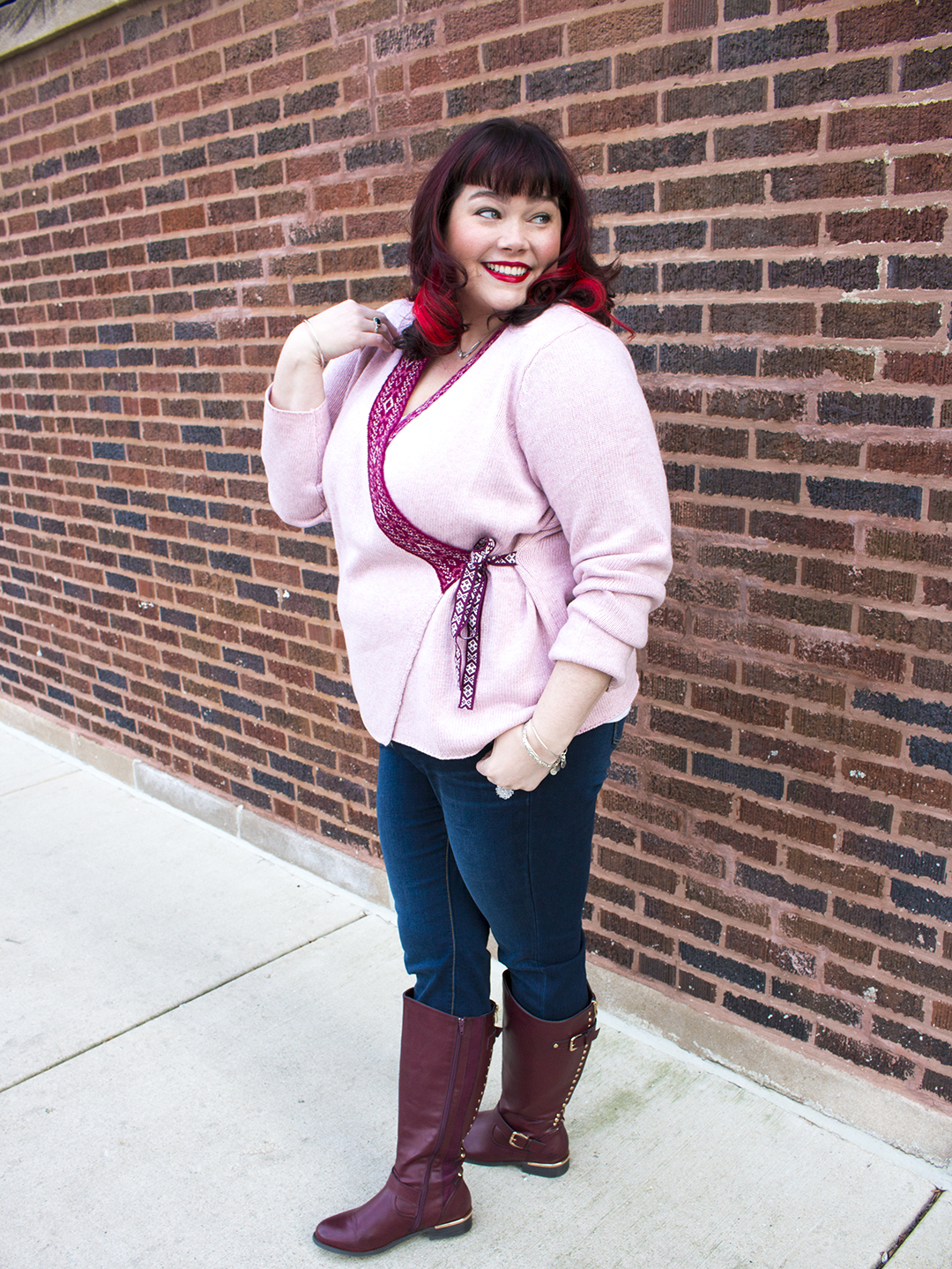 Plus Size Model in a Pink Sweater and Jeans