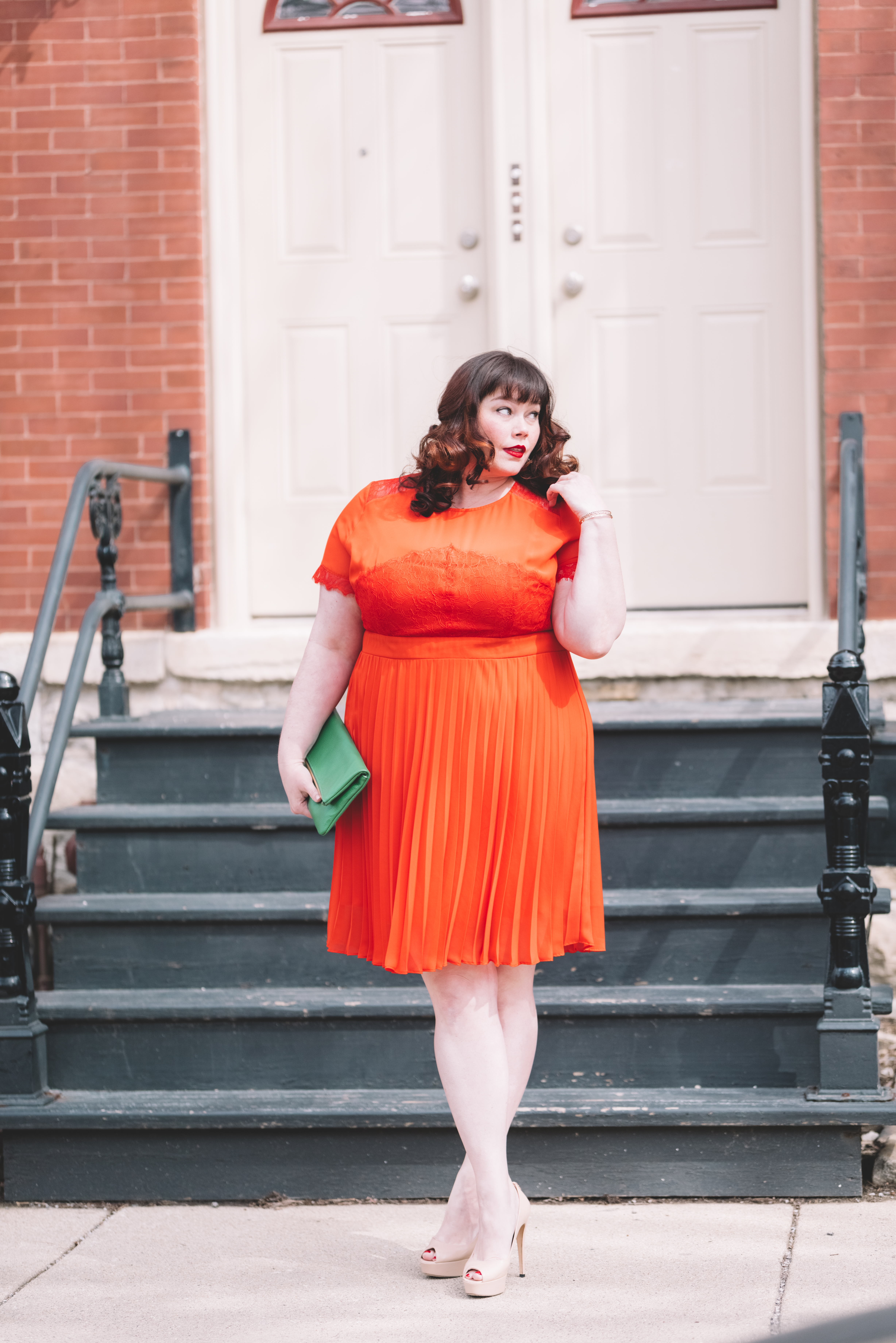 Plus Size blogger Style Plus Curves in an Orange dress and Green Custom Leather Bag from Laudi Vidni
